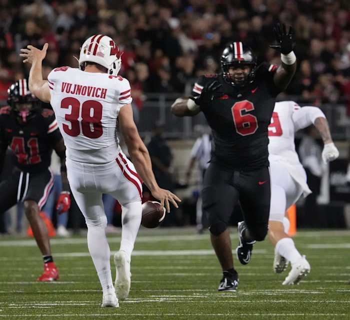 Wisconsin punter Andy Vujnovich kicking the ball against Ohio State.